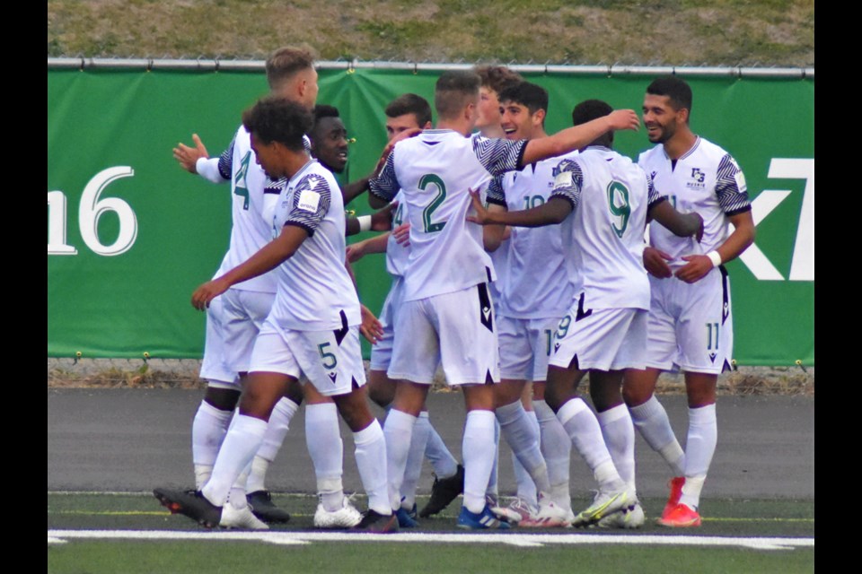 The USask Huskies celebrate one of their four goals against the Lethbridge Pronghorns in their game Friday night at Griffiths Stadium.