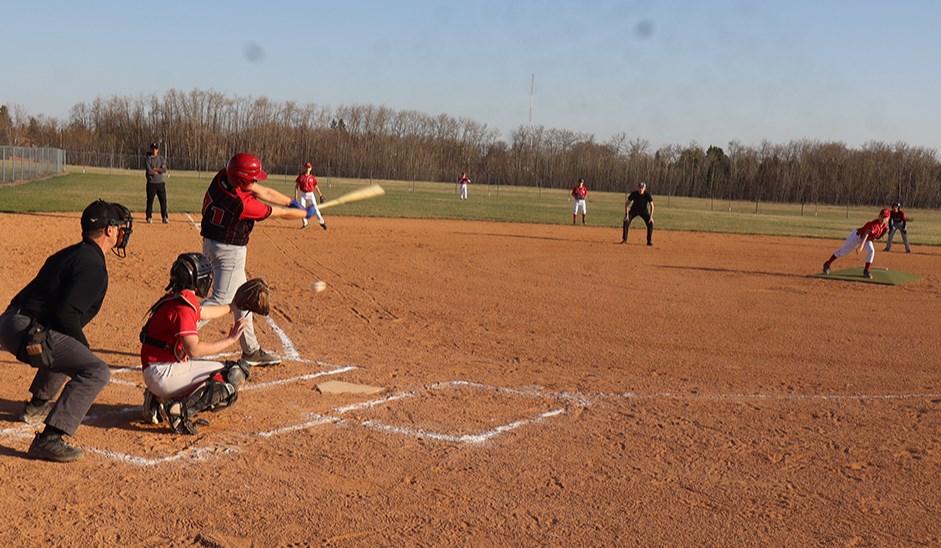 Pitcher Drew Kitchen and catcher Kenzee Kopelchuk of the U13 Canora Reds combined to fool the Yorkton Cardinals hitter on this pitch during the opening game of the minor ball season under sunny skies in Canora on May 7. 