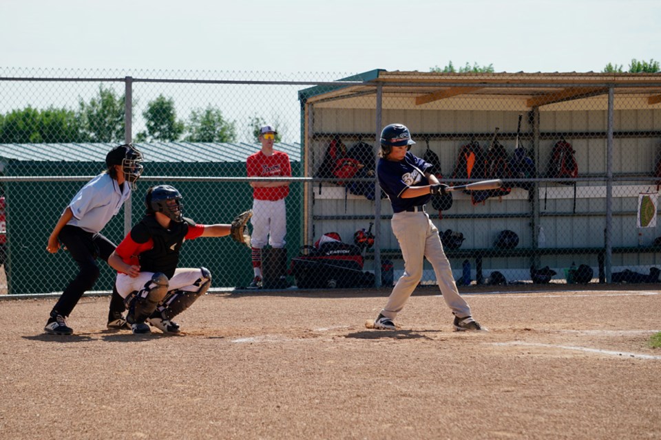 Pierce Lozinsky connects on a hit for the U15 AA Tier 4 Brewers. 