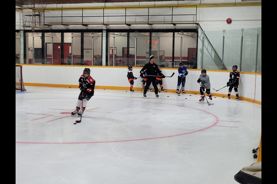 During the Jordan Trach Hockey Camp at the Canora Civic Centre on Oct. 15 and 16, the U13 players went through a variety of drills to improve their hockey skills. Ashton Strelioff, left, worked on his puck handling, with Wade Vangen, grey jersey, all set to follow. Cameron Sznerch, right, waited his turn.