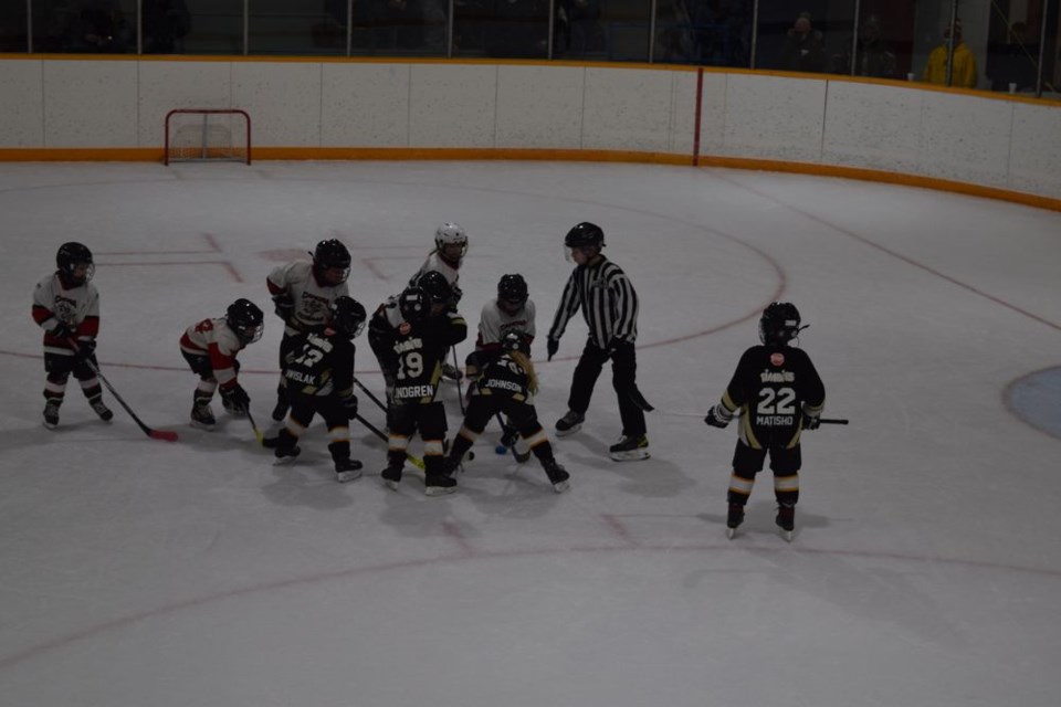 The U7 Canora Cobras (white jerseys) faced off against the Yorkton Ice Caps to kick off Minor Hockey Day in Canora on January 29. At this age, the focus is on fun and learning the game, and no one is too concerned about proper faceoff alignment. / Rocky Neufeld