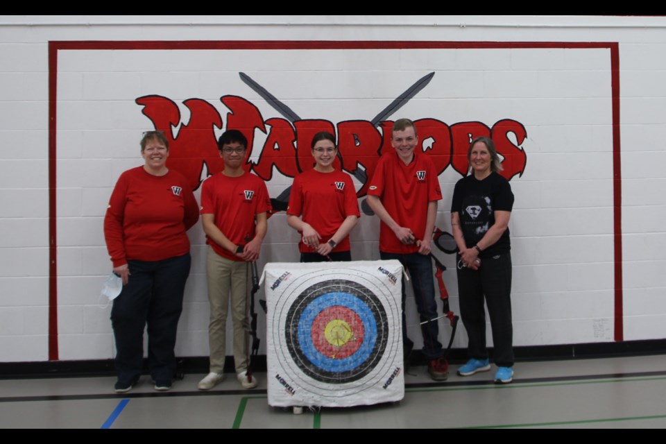 UCHS archery program participants included staff support, Miss Riddell, graduating participant, Ram Felipe, Grace Heck and Sebastain Lauinger, along with coach Michelle Van De Meutter.