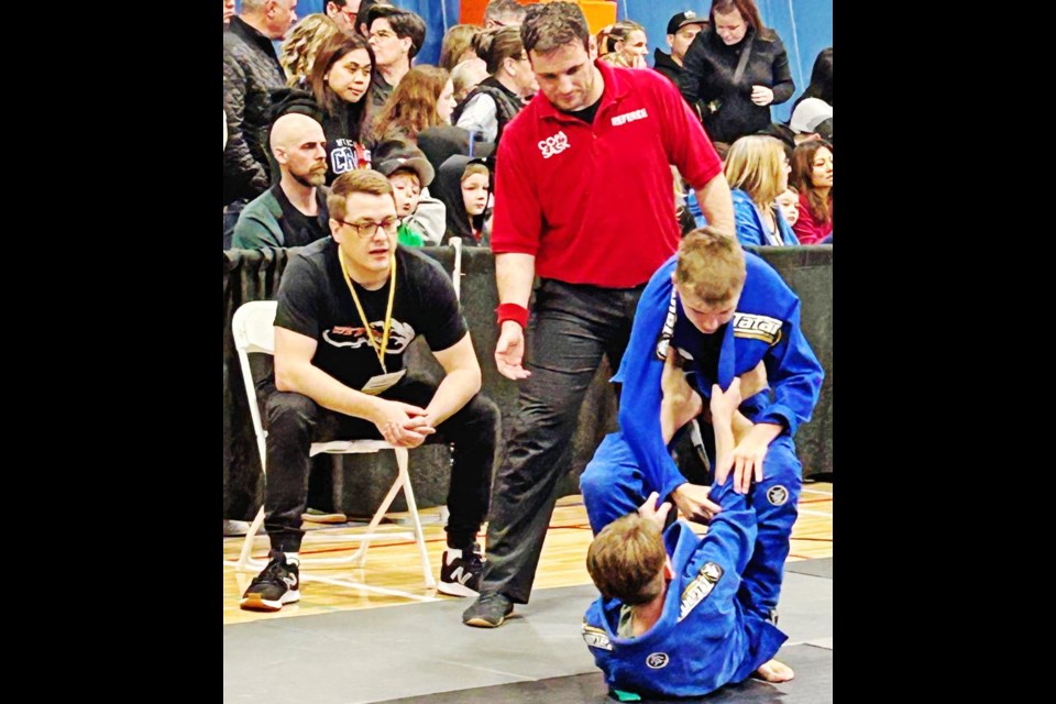 Steve Schuck, left, coached Nikolas Nikulin, who went on to win the silver medal in the Gi division.