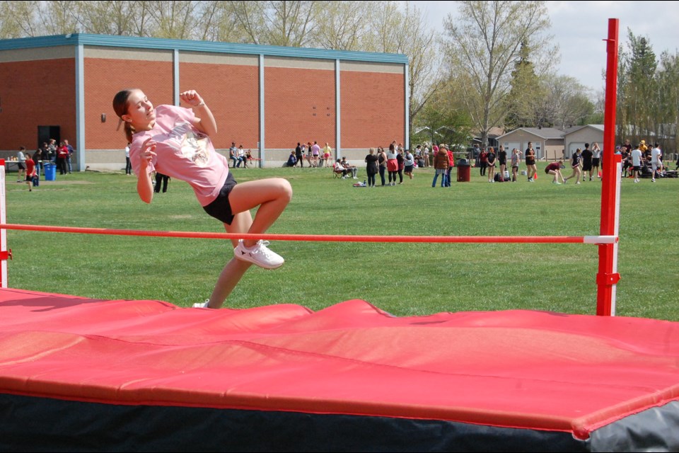 Natalie Bertoia makes a clean jump at the high jump, ending up with 2nd place in the event and earning silver in overall points for the Grade 8 girls.