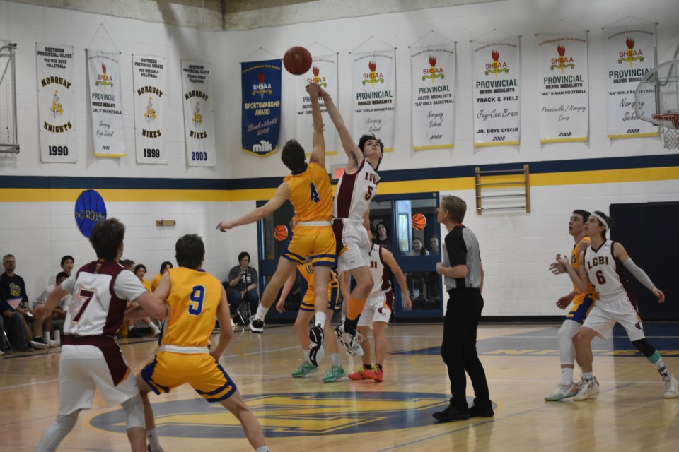 The March 16 game between the Norquay Knights senior boys (yellow uniforms) and LCBI (Lutheran Collegiate Bible Institute) started strong with both teams battling for the opening jump ball.