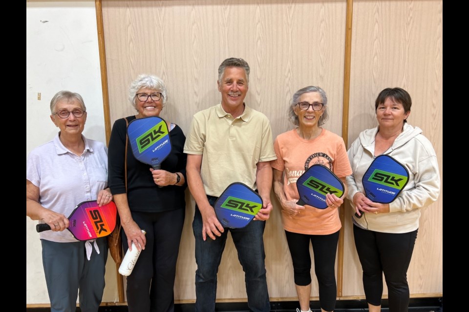 From left, Judy Graham, Gloria Knous, Dave Martell, Jan Sangster and Leona Bowes enjoy a good game of pickleball. 