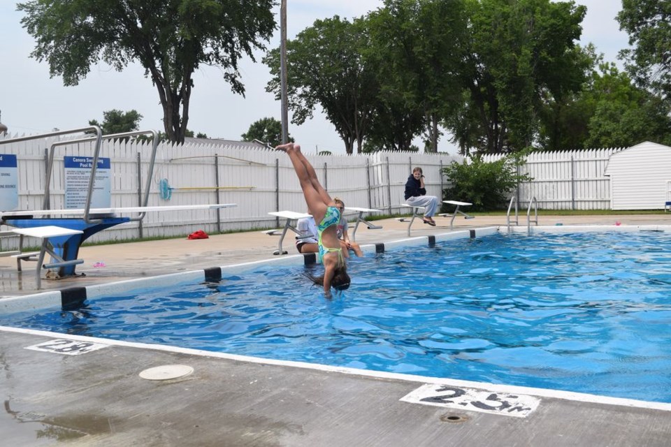 Angel Sliva showed excellent form during the diving competition at the Canora swimming pool on July 19.