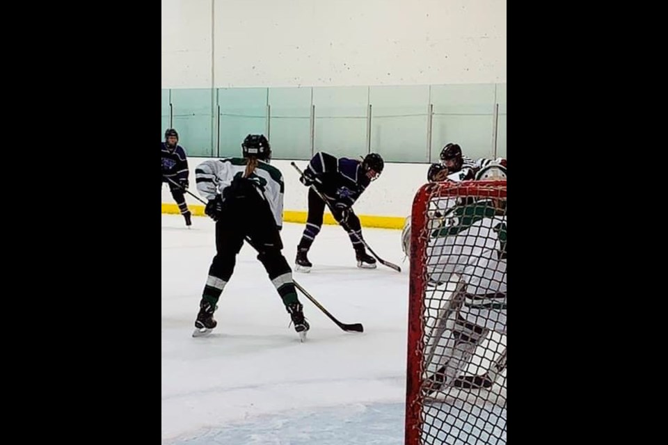 Alaina Roebuck of Buchanan (dark jersey) faced off for the Prairie Ice U15 girls hockey team against a Saskatoon team at the Sask Challenge Cup Tournament in Saskatoon from October 8 to 10. / Photo submitted by Meridee Kopelchuk