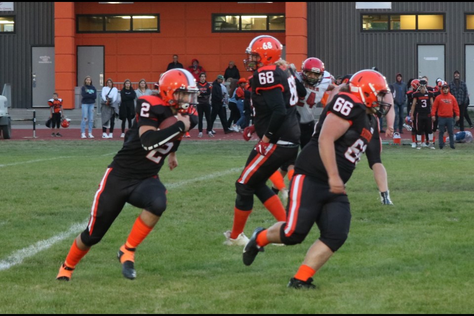 Raider Gridder quarterback Chase Batke goes for a run