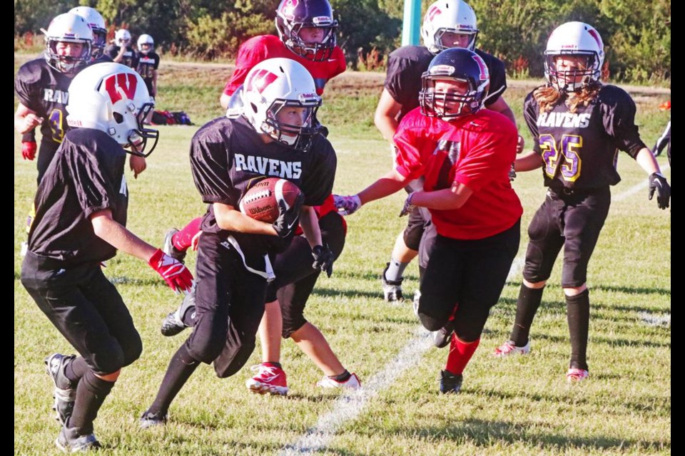 Finlay Clark of the Weyburn U12 Ravens ran for some yards in the game against the Assiniboia Rockets on Saturday.