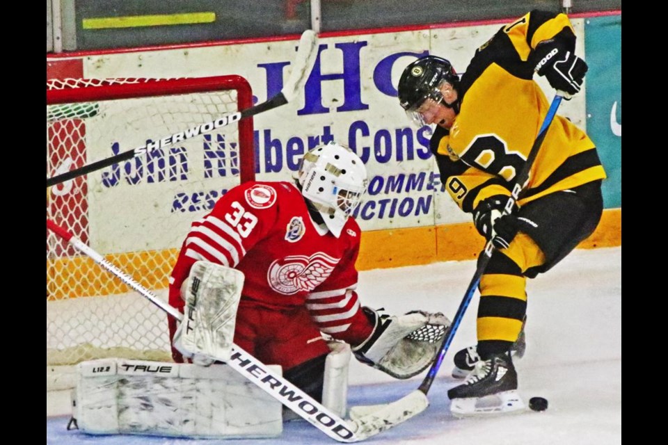 Red Wings goalie Angelo Zol shut the door on an Estevan forward, in this play in the first period of their preseason game in Weyburn on Friday.