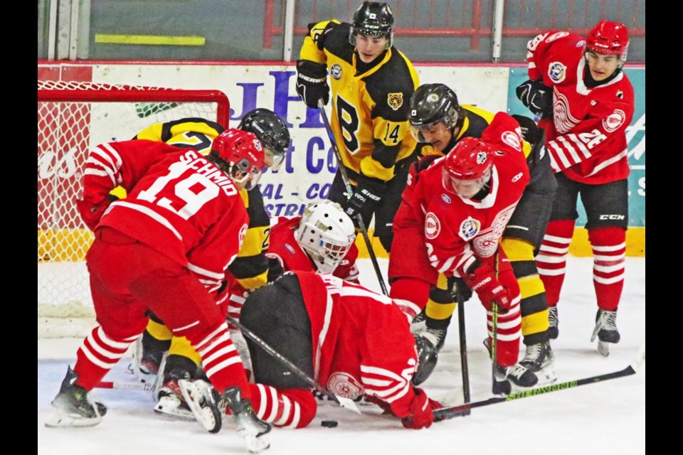 A Red Wing player was on his hands and knees with the puck on the ice below him, during a traffic jam in front of Weyburn's net on Friday night.
