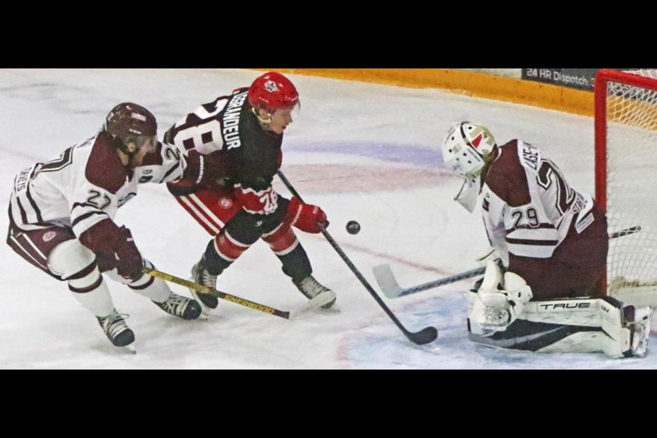 Weyburn Red Wings player Braigh LeGrandeur skated in close as his shot was deflected by the Flin Flon netminder in the first period on Friday night.