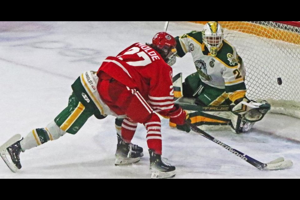 Red Wings player Drew Molde put the puck in behind the Humboldt Broncos goalie in the first period on Tuesday evening.