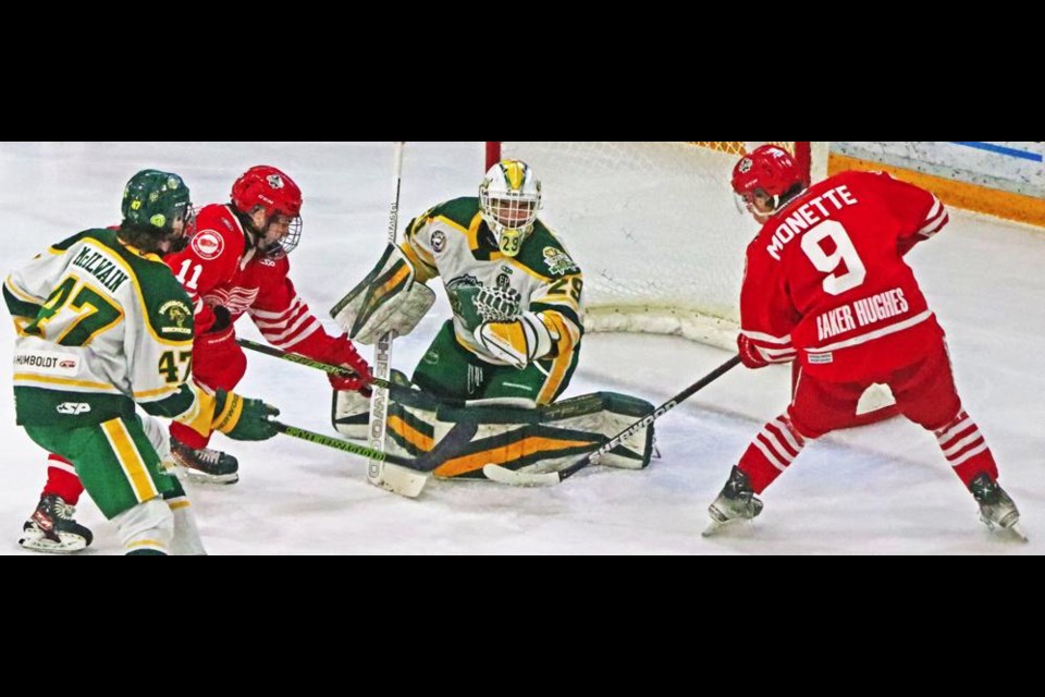 Red Wings players Jacob Visentini, left, and Max Monette both tried for a rebound on the Humboldt Broncos goalie, during Game 3 of their best-of-seven quarter-finals on Tuesday night. Weyburn came away with the win by the score of 5-3.