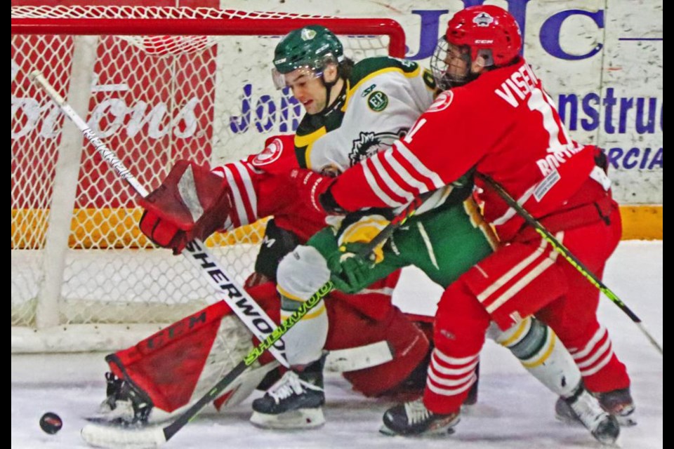 Red Wings player Jacob Visentini wrapped up an attacker from Humboldt to keep him from poking the puck in to Weyburn's net on this play.