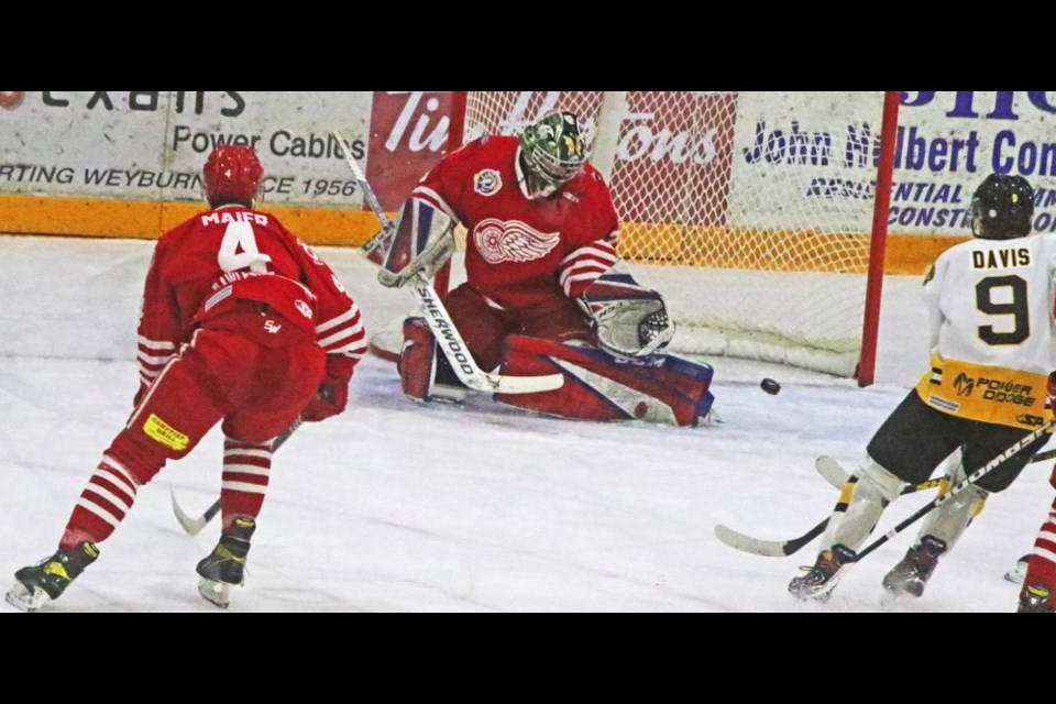 Red Wings defenceman Ian Maier watched as Estevan left-winger Cody Davis had his shot deflected off the pads of goalie Dazza Mitchell.