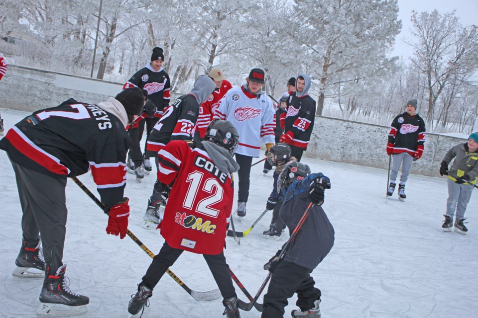 A face off for many young players and members of the Richardson Pioneer Weyburn Red Wings. At front are Red Wings player Lucas Jeffreys, and youth Ben Cote and Dominic Gray.
