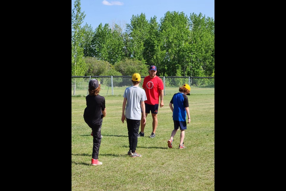 Prairie Baseball Academy pitching coach and UMB alumni, Rhett Feser, led more than 50 kids over two days in a baseball clinic held in Unity.