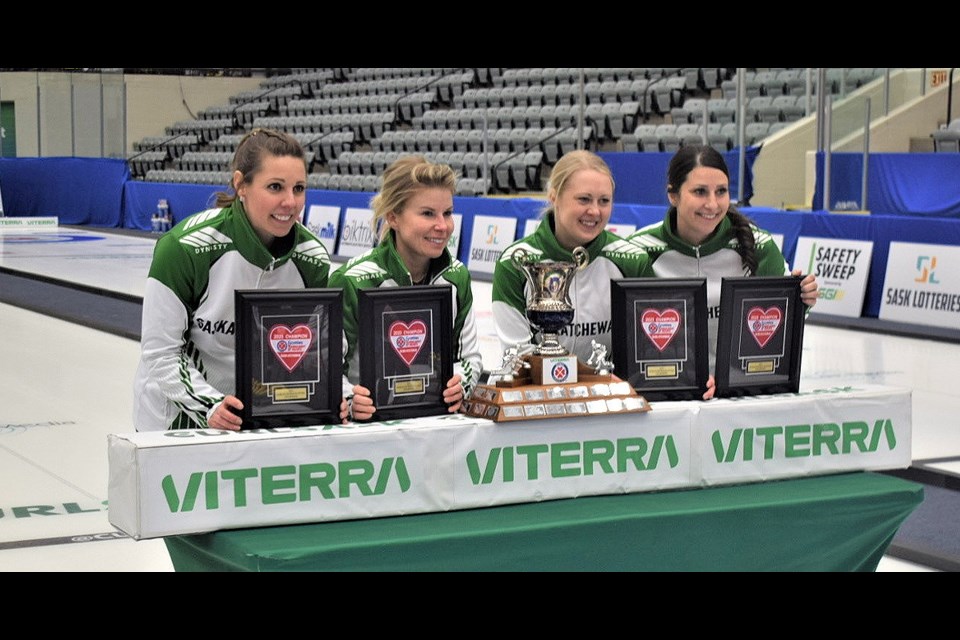 Members of the Robyn Silvernagle rink gather after winning the Viterra Scotties Tournament of Hearts. 
