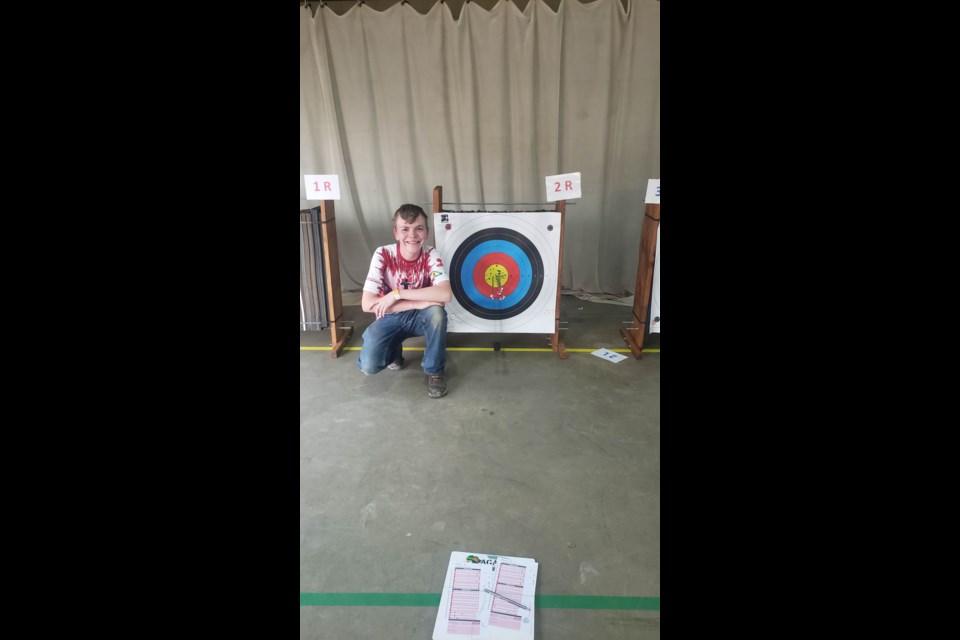 Unity's Sebastian Lauinger in front of a target as part of this Team Canada Archery experience in South Africa.
