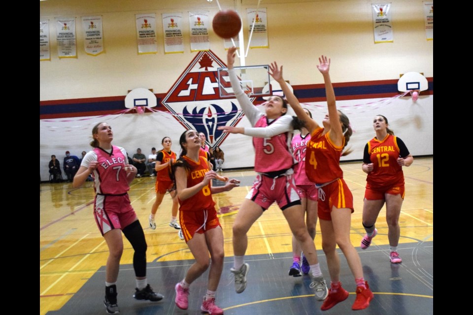 Presley Hollingshead (5) of the Elecs goes up for a rebound during the pink game Friday night.