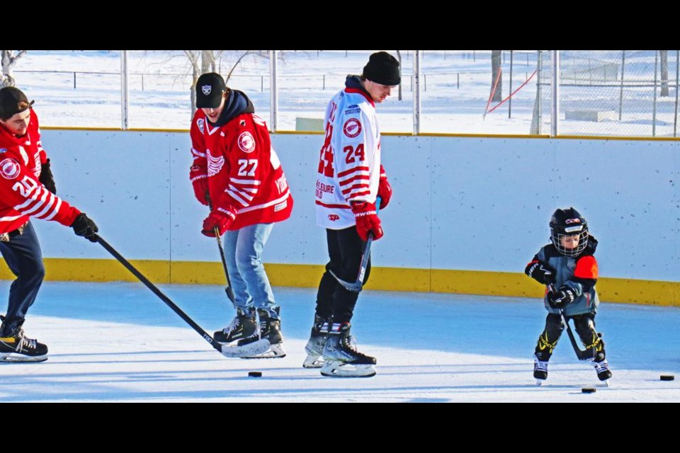 Red Wings players Jackson Hassman, Ethan Whillans and Mitch Wilkie enjoyed a skate at the Credit Union Spark Centre's outdoor rink on Saturday afternoon