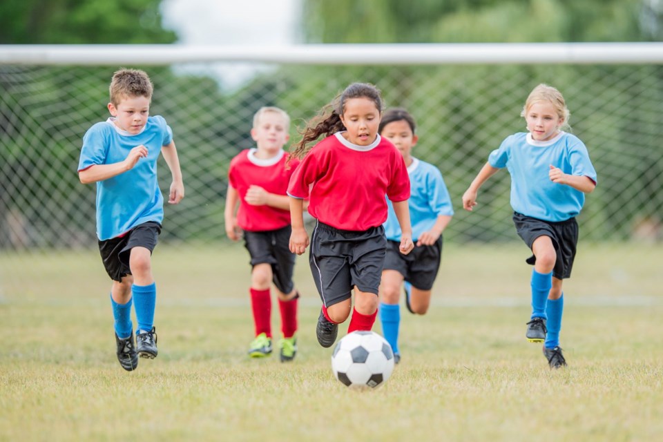Multiple health and wellness benefits come from children playing soccer.