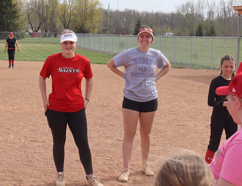 Instructors Mackenna Meyer (left) and Jordan Schell, U19 softball players from Regina, kept things fun while teaching valuable skills at the Softball Saskatchewan Basic Skills Clinic in Canora on May 10.