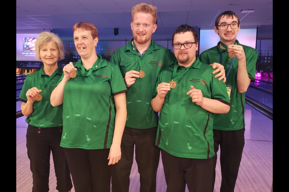 A bronze medal was won in the team event. From left are coach Les, Leah, Antonius, vernon and Daemeon.