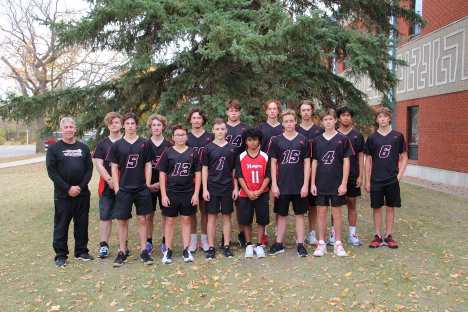 Coach Ken Parker stands with the UCHS senior boys' volleyball team who will play host to 3A SHSAA provincials Nov. 26-27.