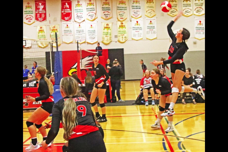 Weyburn Comp Eagles player Amryn King jumped high to hit the ball back over to Yorkton's side in this play at the sr. girls tournament on Saturday.