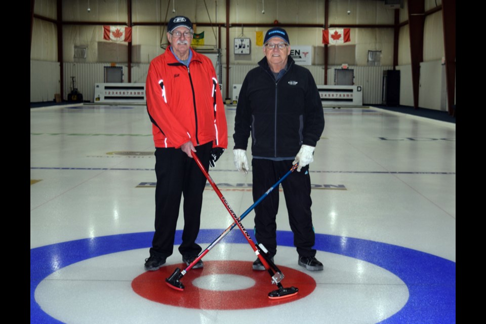 For the second year in a row, Bill Foreman, left, and Robert Waselenko were the winners of the Canora Two-Person Stick Bonspiel.