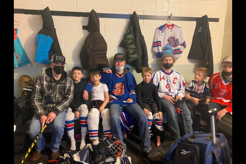 Some of the U15 Highway 9 Predators players gave a hand in helping to tie skates and expressing encouragement for the younger hockey players during the Sturgis Hockey Day on February 12. From left, were: Trever Geistlinger, Nate Johnson, Drae Peterson, Logan Wolkowski, Koy Babiuk, Mason Babiuk, Coy Kraynick and Cooper Kraynick.