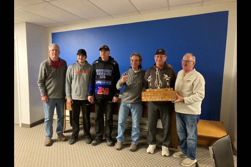 For the second year in a row, the Canora Pioneer Hybrid representative won the Duck Mountain Super League curling championship after the dust had cleared at the playoffs in Swan River on Dec. 15. From left, were: Bill Schnieder (original league organizer), Lane Zuravloff (skip), Kent Zuravloff (third), Zeno Gulka (second), Bob Kolodziejski (lead) and Tom Jordens (original member and presenting the trophy). Unavailable for the photo were Canora team members Brandon and Rob Zuravloff, and Gil Comeault, an original league organizer.