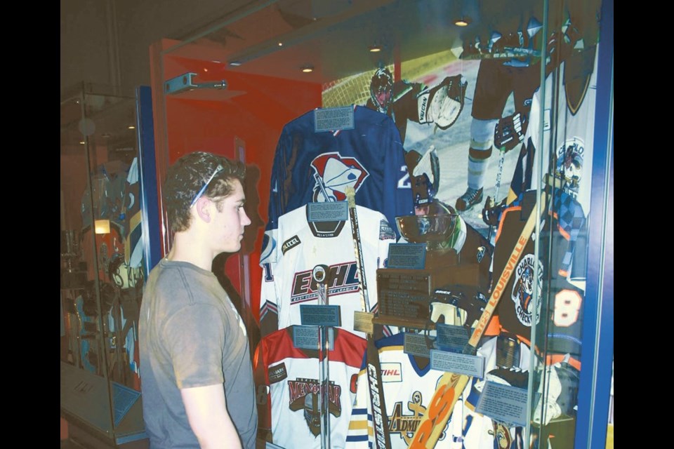 Terrier Derek Serdachny checks out a display at the Hockey Hall of Fame.
