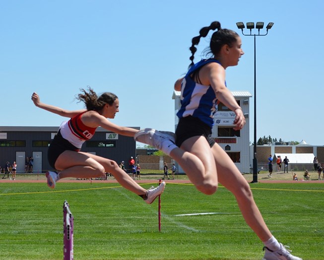 Danielle Dutchak, left, won the 80m hurdles and qualified for provincials.