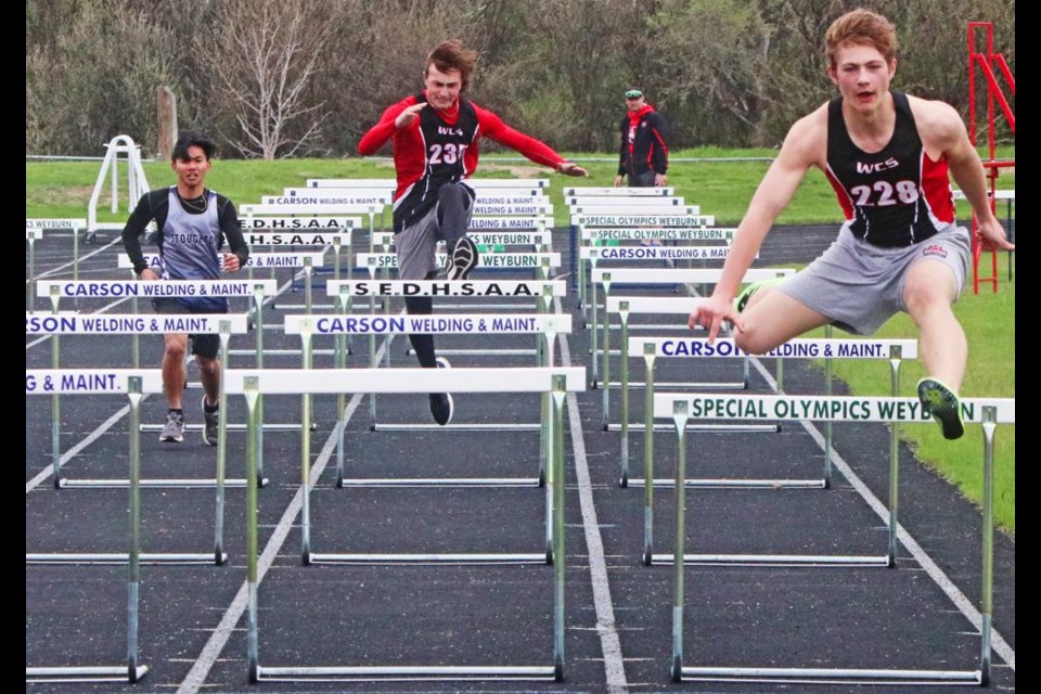 The left runner is from Stoughton; the middle runner is Jyler Goebel and runner on the right is Conner Kerr, and the official in the background is Conner's dad, WCS coach Jody Kerr