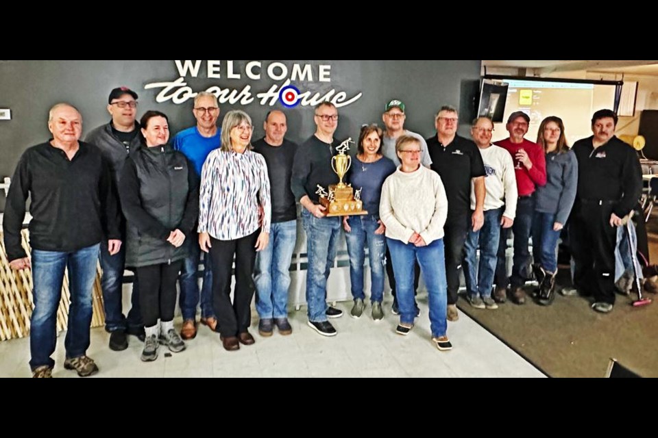 The team of curlers aged 50 years and over claimed the first-ever Turner Cup, after competing against the under-50 team on Friday and Saturday at the Weyburn Curling Rink. Holding at centre is team captain Bruce Miller. The senior team won three of their last four games to claim the championship trophy.