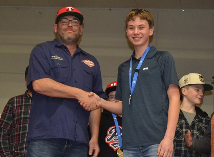 The Most Dedicated Award for the U13 Preeceville Pats was presented to Chance Weinbender of Canora, right, by Chris Halkyard, coach.
