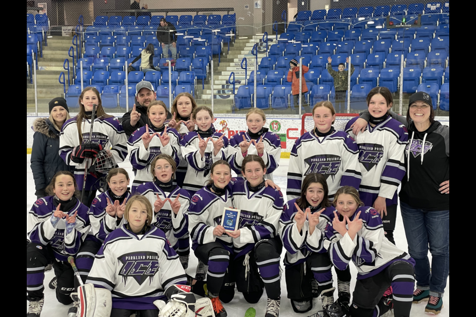 The Parkland Prairie Ice, a new U13 girls hockey team this season, won a tournament held in Melville on Dec. 10 and 11 thanks to five straight wins. From left, were: (standing) Bowdrie Northrop of Norquay (assistant coach), Tessica Mydonick of Canora, Jess Harper of Canora (assistant coach), Avery Masley of Sturgis (in front of Harper), Isabelle Smith of Yorkton, Chloe Doogan and Ryea Harper of Canora, Allie Babiuk of Sturgis, Makayla Johnson of Preeceville and Nicole Korpusik of Norquay (head coach); (kneeling) Camryn Kosokowsky of Kamsack, Cassidy Wolkowski of Canora, Rowyn Johnson of Norquay, Avery Lammers and Harper Danchilla of Yorkton, Rylee Coleman and Morgan Olson of Sturgis; and (front) Ty Northrop of Norquay (goalie).