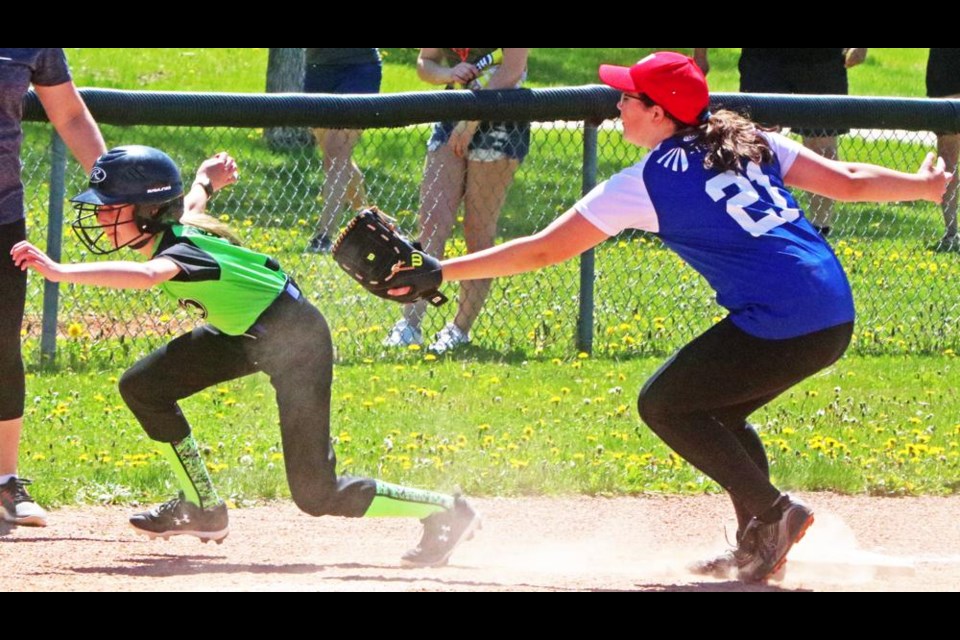 A Weyburn Jay player evaded the third baseman from the Weyburn Blue Sox in this inning-ending play on Saturday