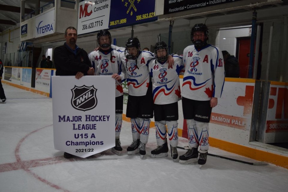 Accepting the ‘A’ banner on March 27 from a Major Hockey League representative after their victory over Indian Head in the championship final, from left, were the on-ice leaders of the U15 Highway 9 Predators: captain Mason Babiuk, and assistant captains Rhett Ludba of Canora, Jace Vogel, and Owen Friesen of Canora.