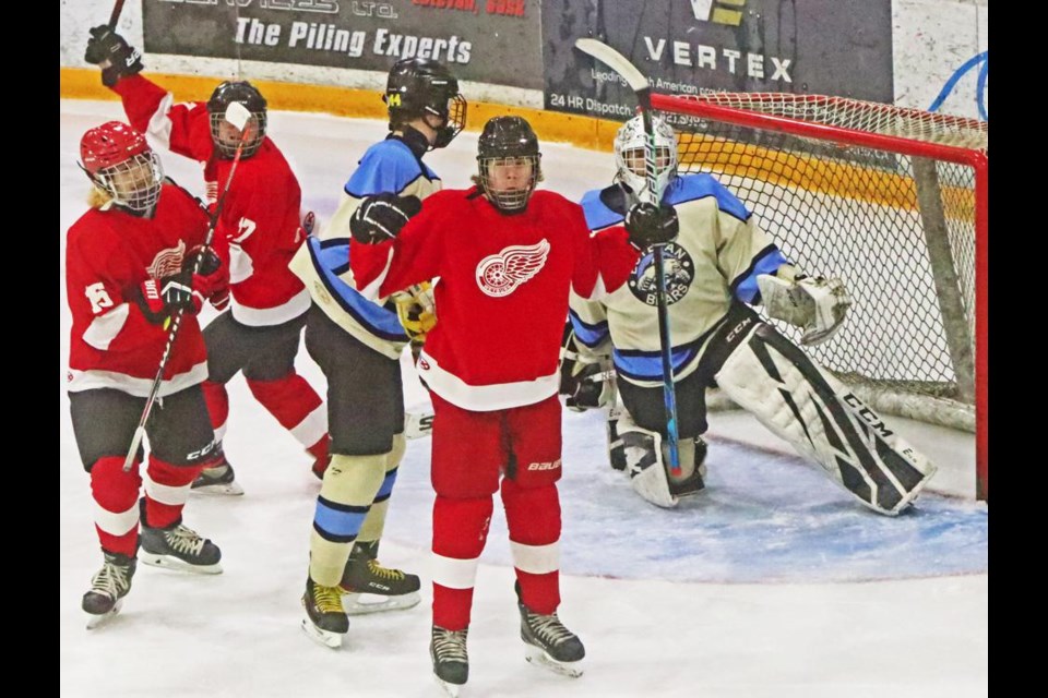 Wyatt Chinski of the Weyburn U18 Barber Motors Wings raised his hands in celebration after scoring the game's first goal in their match vs Estevan Bears on Saturday evening.