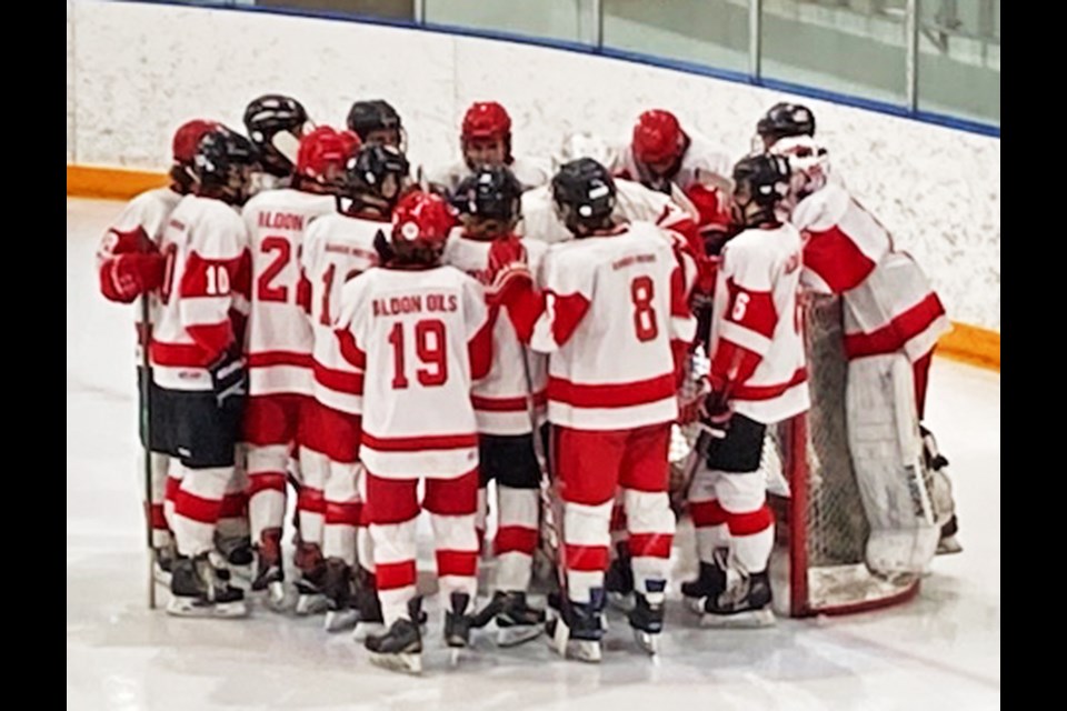 The Weyburn U18A Wings gathered around the goaltender prior to the start of the game in Swift Current on Sunday afternoon