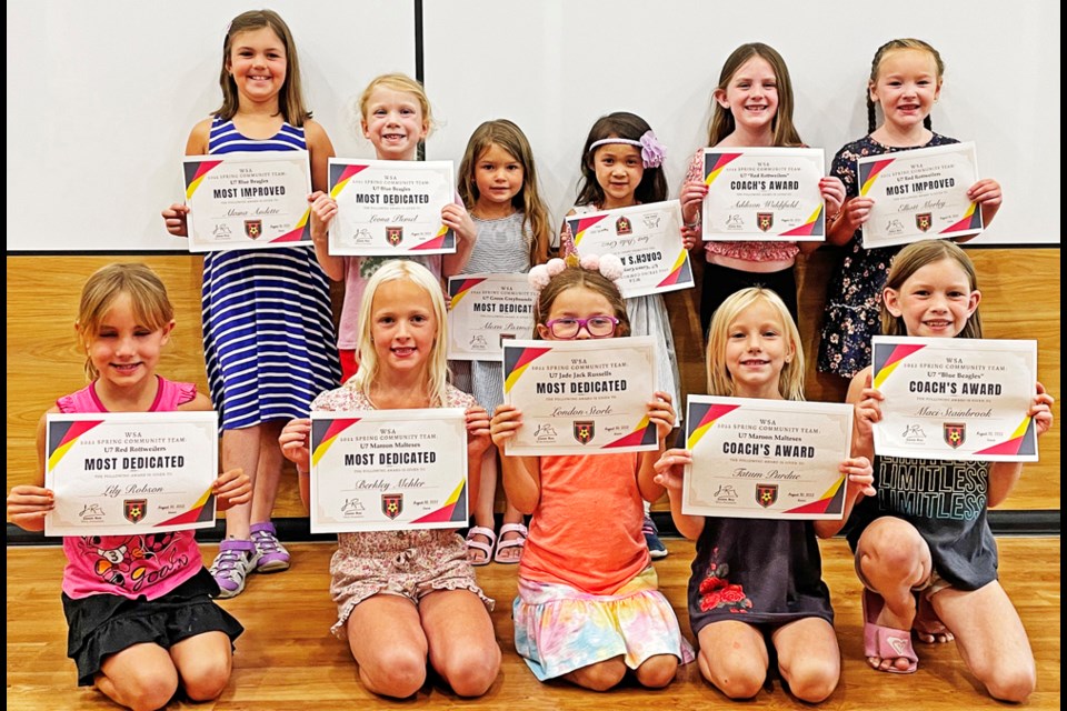 The U7 girls gathered with their certificates at awards night on Aug. 30.