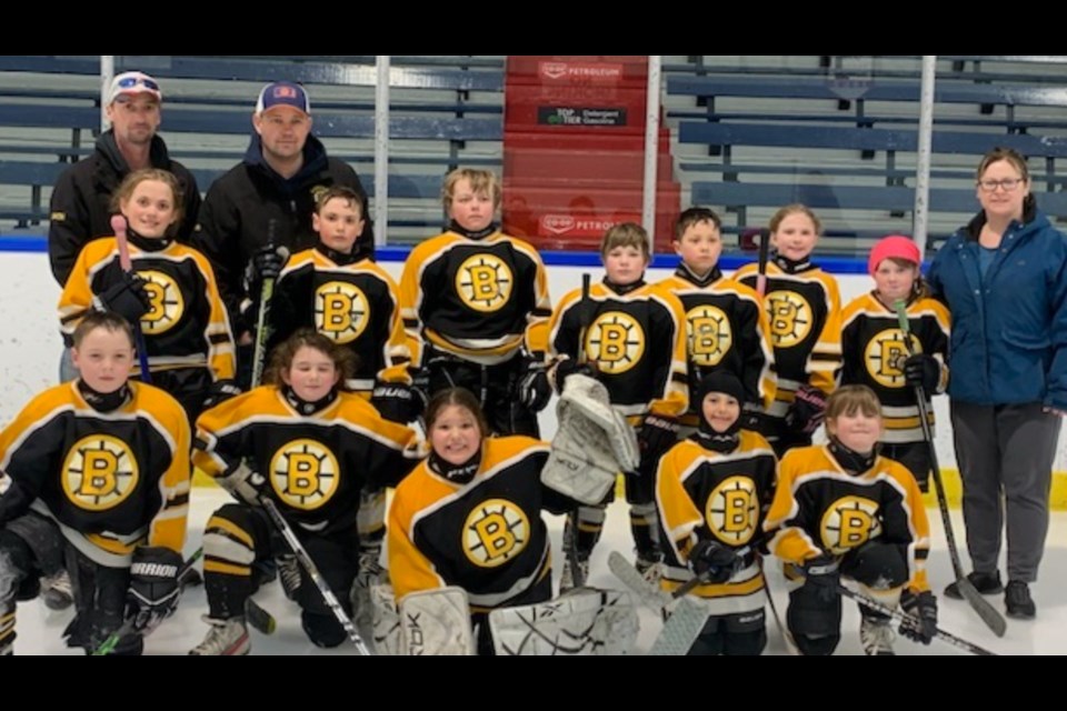 The Under 9 Bjorkdale Bruins claimed victory in their first playoff game against the Kinistino Tigers on Tuesday, March 7 and then were defeated by the Tisdale White Ramblers. From left, starting in the back, are asst. coach Orin Bratton, and head coach Marty Horn, In the middle row are Guilianna Vecchio, Kayden Bratton, Cache Schapansky, Karsen Babcock, Bentley Johnson, Wmberly Bartsch , Brynn Goldsworthy and manager Nicole Goldsworthy, In front are Ryan Bratton, Nora Horn, Madison Johnson, Avery Bintner and Sarah Goldsworthy.