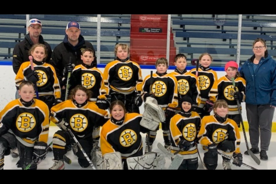The Under 9 Bjorkdale Bruins claimed victory in their first playoff game against the Kinistino Tigers on Tuesday, March 7 and then were defeated by the Tisdale White Ramblers. From left, starting in the back, are asst. coach Orin Bratton, and head coach Marty Horn, In the middle row are Guilianna Vecchio, Kayden Bratton, Cache Schapansky, Karsen Babcock, Bentley Johnson, Wmberly Bartsch , Brynn Goldsworthy and manager Nicole Goldsworthy, In front are Ryan Bratton, Nora Horn, Madison Johnson, Avery Bintner and Sarah Goldsworthy.