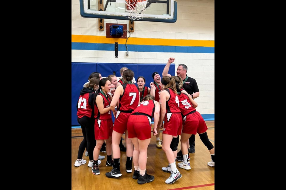 UCHS Coach, Mr. Melnyk, celebrates Warrior pride as the UCHS girls take home provincial bronze at Hoopla 2022.