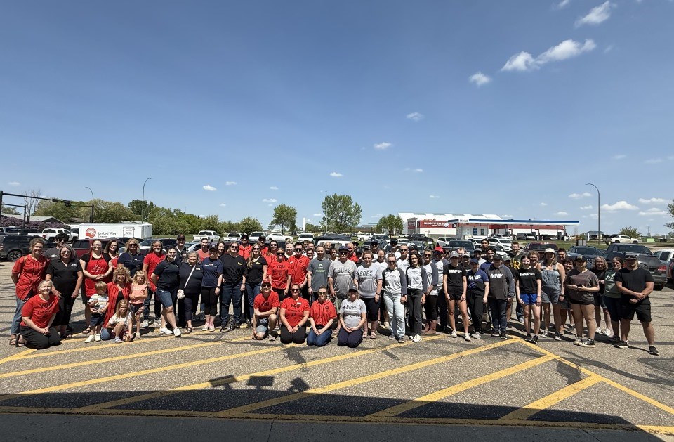 Volunteers gather for a group photo during the Day of Caring. 